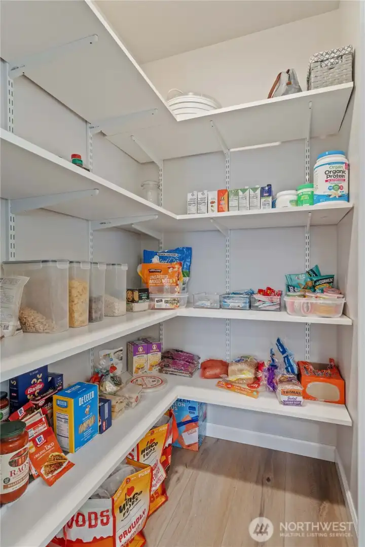 Custom Pantry with glass door allows for so much storage!