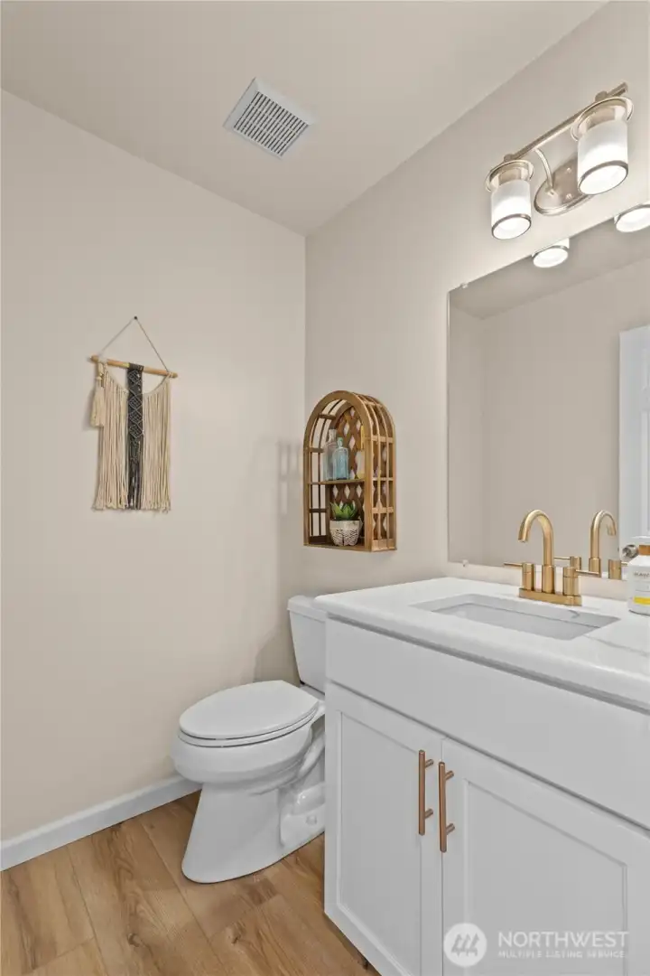 Powder Room with matching cabinetry to Kitchen.
