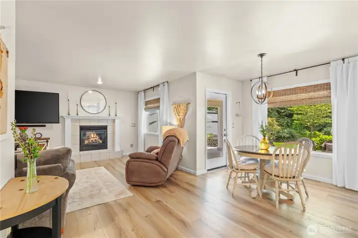 Family Room and Dining Nook. Door leads to Covered Back Deck.
