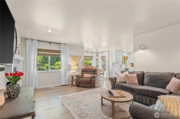 Family Room with Laminate Hardwood Floors and Gas Fireplace.