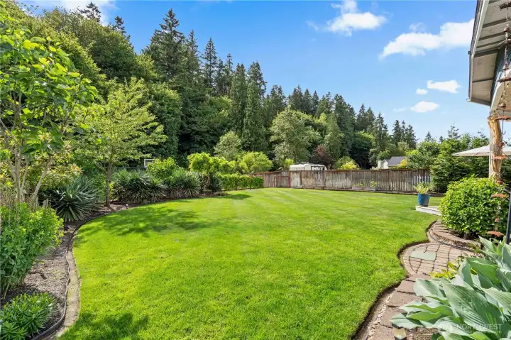 Expertly landscaped grounds feature lush lawns, mature fruit trees, cascading wisteria, hidden sport court, and exceptional outdoor living spaces designed to impress.