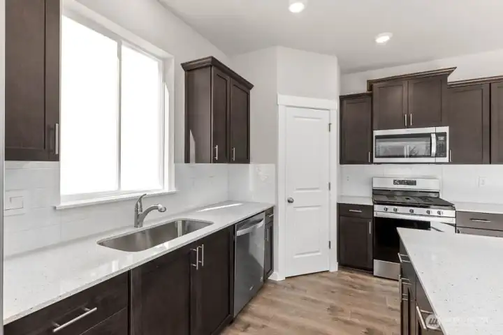 Modern stainless steel appliances. Photos are for representational purposes only. Colors and options may vary.