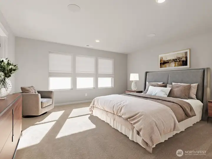 Large primary bedroom easily fits a king sized bed. Photos are for representational purposes only. Colors and options may vary.