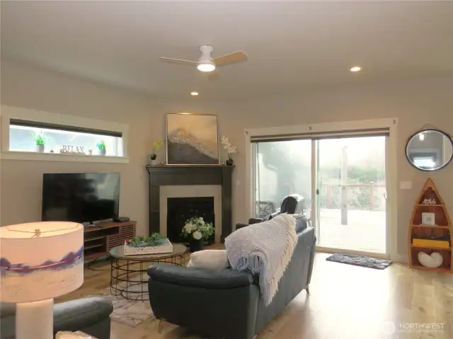 ENTER THE HOME THROUGH THE HALLWAY TO THE SECLUDED OPEN GREAT ROOM WITH VINYL FLOORING THROUGH OUT! GO THROUGH THE SLIDING DOORS TO THE TREX DECK AND EASY CARE LANDSCAPING!
