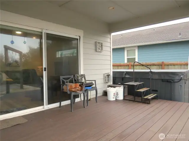 OUTSIDE THE GREAT ROOM IS THIS FULL TREX COVERED DECK! THE STEPS LEAD TO A LAP POOL!