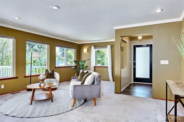 Foyer to living room which has walls of windows to maximize the glorious view.