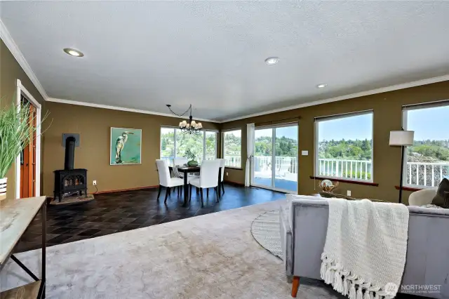 Living room flows to dining room. Natural gas freestanding stove. Slider to deck.