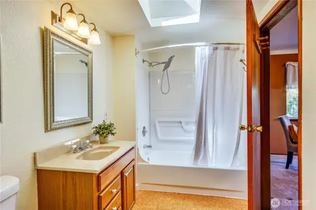 Full bath on main floor off bedroom but also has access from hallway.