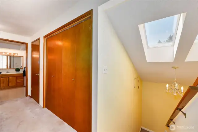Upper level has laundry and 3 bedrooms including primary suite. Lovely skylights!