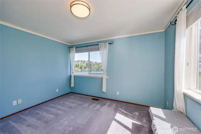 Bedroom 1 of 3 upstairs, 4 total. Great views and a built-in window seat.