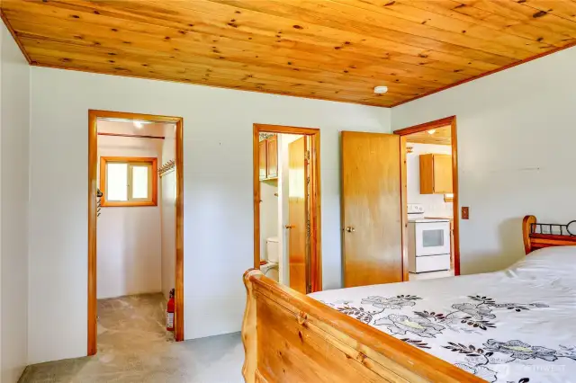 Southwest bedroom with 3/4 bath (right) and walk-in closet.