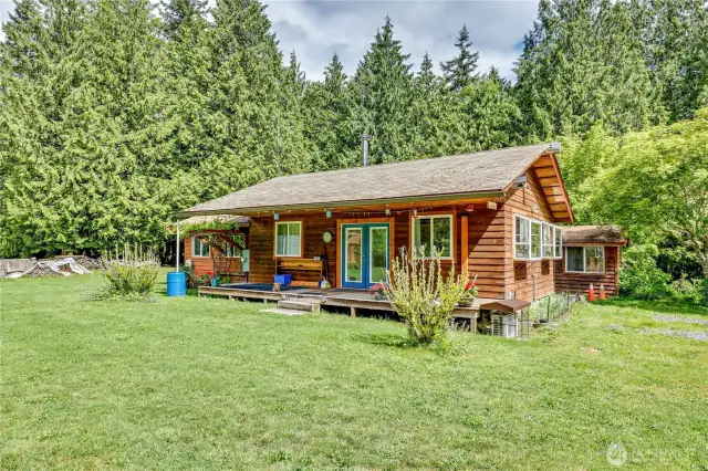 Northeast cabin.  Laundry room on the left and the well pump house behind on the right.