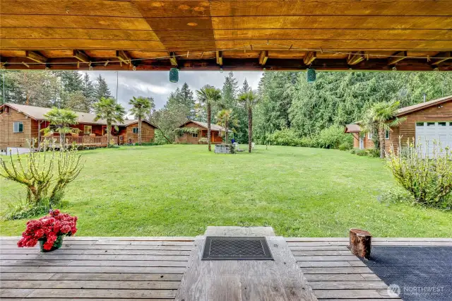 Northeast cabin porch looking to the central fire pit and compound.