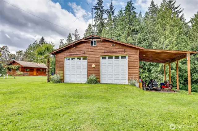Shop with carport.  The shop is fully insulated and has a wood stove for heat.