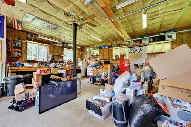 Shop interior.  Fully insulated and with storage in the attic.  Also, a 1/2 bath that is connected to the septic system.