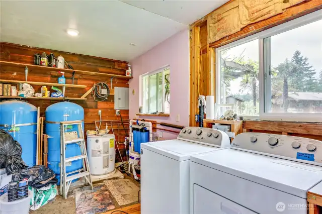 Laundry room and pressure tanks for all four structures.