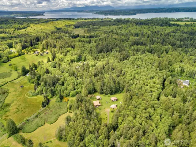 Four buildings in a compound like setting, with privacy, quiet and all the trails you could ever imagine.  Walkers, hikers, mountain bikers, dirt bikes and ATV's riders will all enjoy this one-of-a-kind Kitsap Peninsula setting.