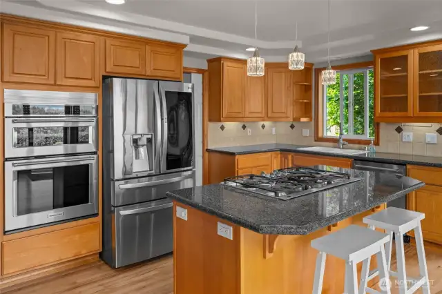 Welcome to your bright open kitchen with views of the mountains. New appliances, custom cabinets and an oversized pantry make this an enjoyable place to be.