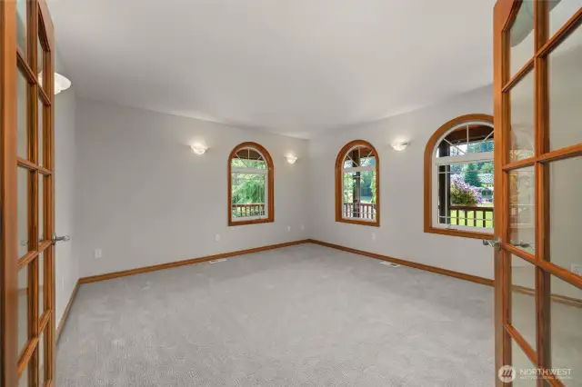 Main level bedroom that has been recently used as an office.