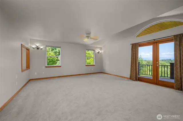 Master bedroom with a walk out balcony that offers incredible views.