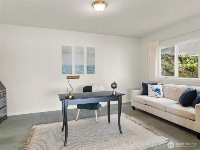 This is the fourth bedroom, located on the main floor just off the living room. It's currently staged as an office area, but with three additional bedrooms, plus a bonus room downstairs, there's plenty of configuration options for this space!