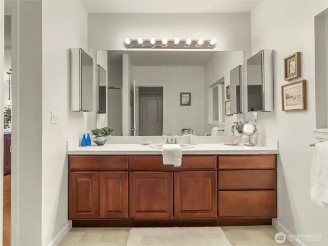 This main level bathroom has two entry points: one to the main living area, and the other enters into the wak-in/walk-through closet, which connects to the fourth bedroom.