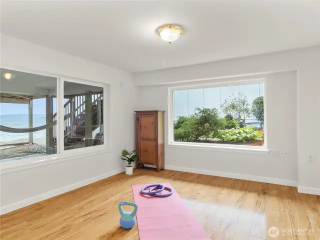 Bonus room on the basement level is filled with natural light. Use as a workout space, in-home office, or guest room - the possibilities are endless!