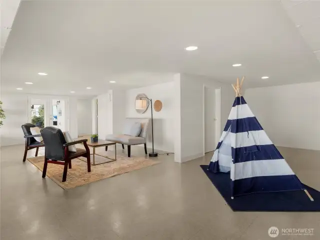 This area could be used as a guest suite, play area, rec room, or even work from home space. There are two large storage spaces here too - one with access to the exterior, which is ideal for kayak storage.