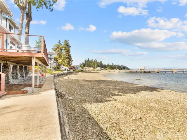 Plenty of waterfront entertaining areas. Large deck above and even more space below with the covered patio and large concrete side area.