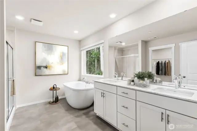 Primary ensuite features double sinks, soaking tub and luxious shower.Photo's are for representational purposes only. Colors and finishes may differ.