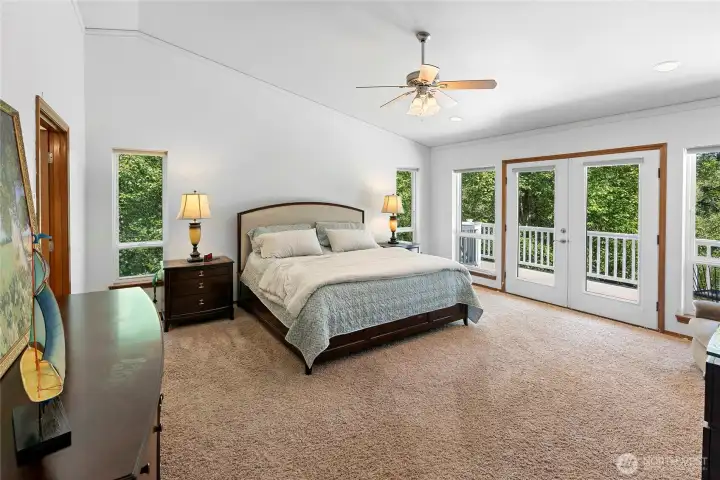 Primary bedroom from entry.  Double door deck access.