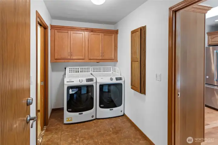 Mud and laundry room off Garage access, Primary Bath, and Kitchen.