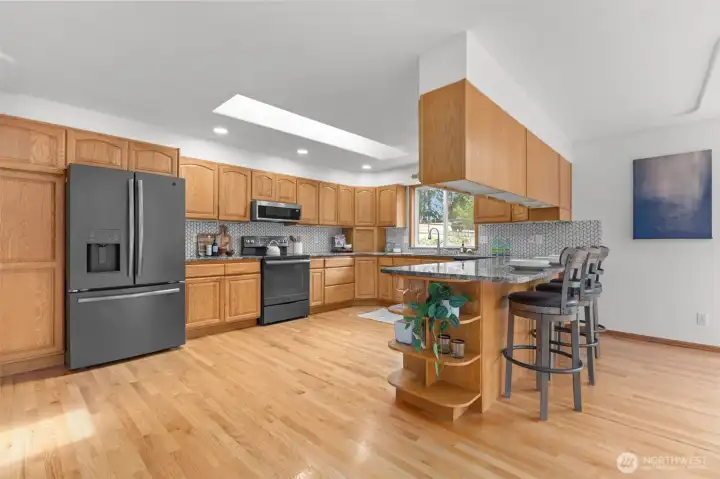 Large kitchen with soild oak cabinets, newer slate stainless appliances, and great storage and counter space.