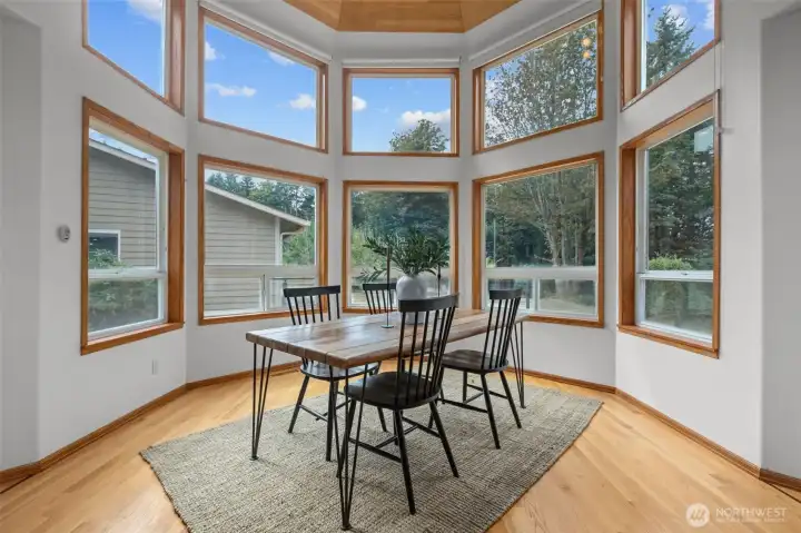 The second turret room offers for a gorgeous dining space and compliments the expansive deck/entertaining space just steps away.