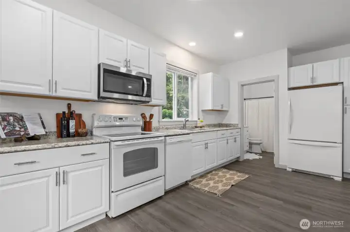 New cabinets, counters, trim, flooring, paint and updated bathroom!