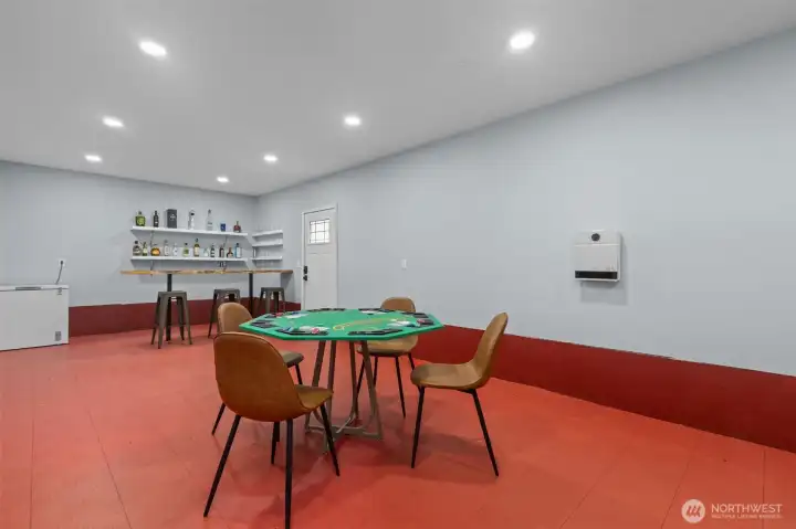 Finished space in basement/crawlspace with custom bar! PErfect space for home gym, "man cave", or just heated storage if you prefer!