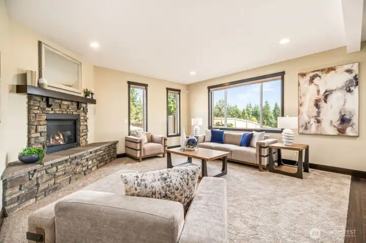 Bright and cozy family room with corner fireplace
