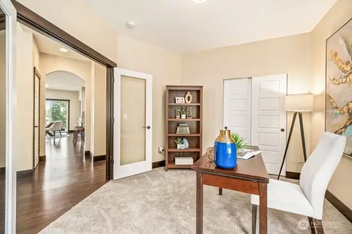 Good size office with French door and storage space.