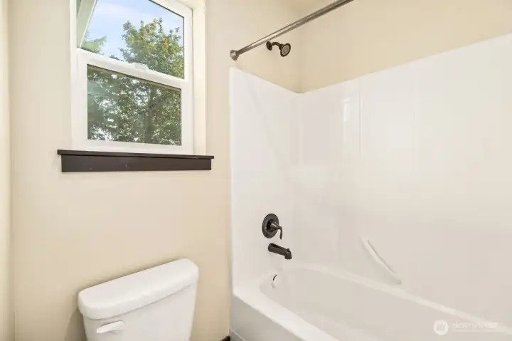 Separate space for toilet and tub/shower.