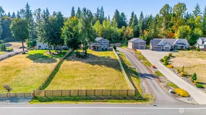 Fully fenced and sun wrenched back yard.