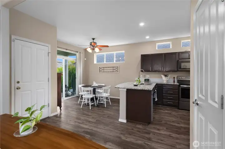 Modern kitchen with quartz countertops, stainless steel appliances, and a convenient eat-in space just off the kitchen.