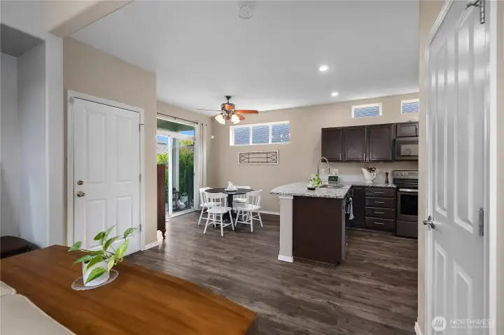 Modern kitchen with quartz countertops, stainless steel appliances, and a convenient eat-in space just off the kitchen.