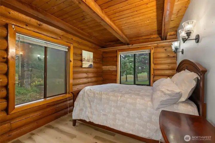 Primary Bedroom on the main floor, with beautiful views to Bring in the outdoors.