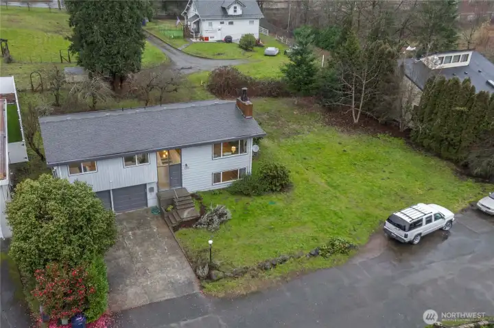 Additional features include a heat pump with A/C and a composite deck, a relaxing sauna room, and a two-car garage