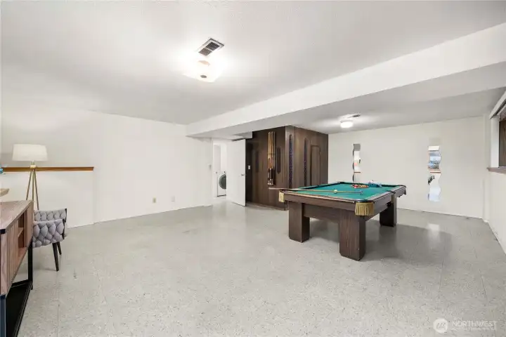 The expansive bonus room downstairs offers excellent versatility for a variety of uses