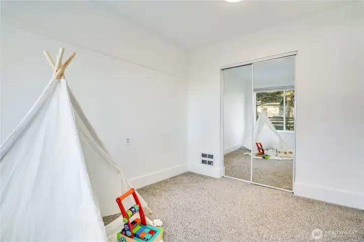 A well-placed closet offers practical storage for this versatile space.