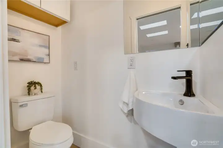 A wall-mounted storage cabinet keeps everything neatly organized.