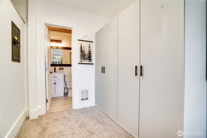 Recently added armoires complement the primary closet to provide ample wardrobe storage.