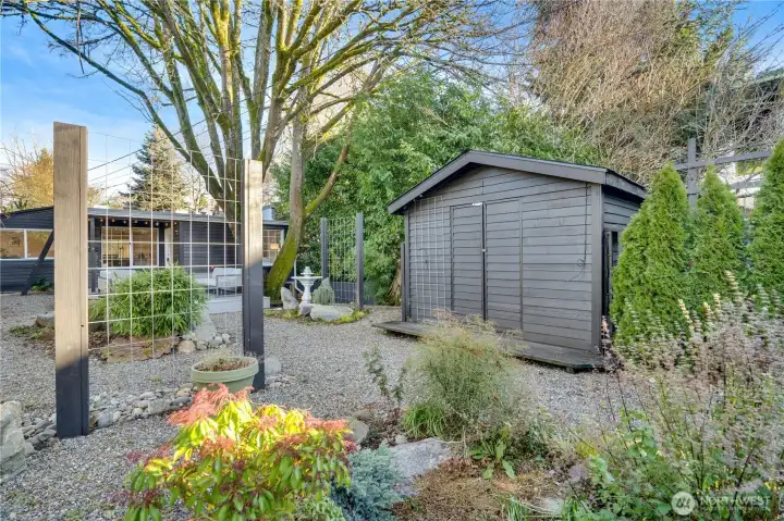 The backyard offers endless possibilities—create garden beds, add additional seating for entertaining, or keep it as-is and enjoy your low-maintenance retreat! A large shed adds valuable storage for tools and seasonal items.