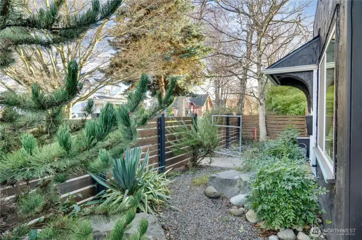 Lush, low-maintenance landscaping creates a refined and welcoming entry to the home.